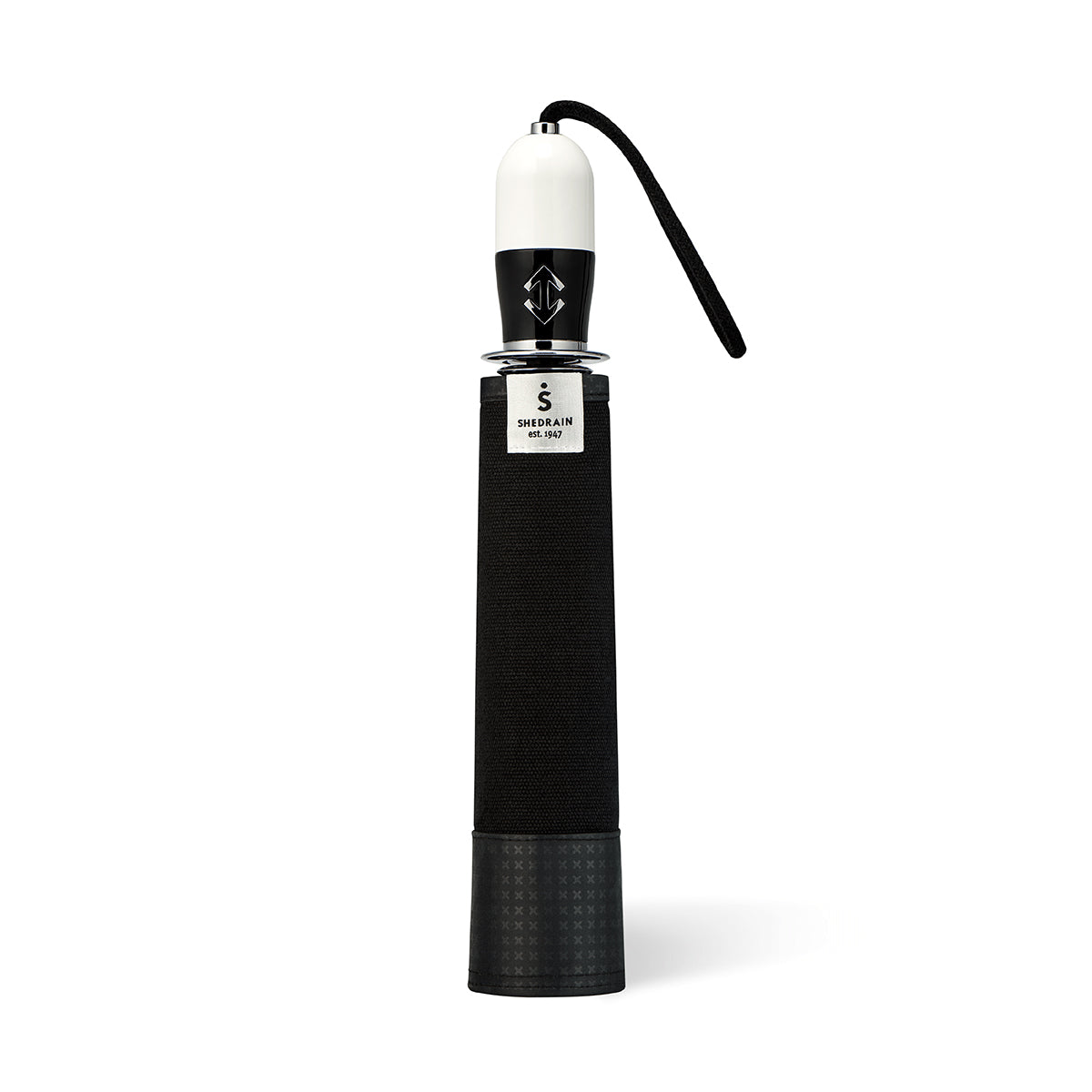 straight on view of a handmade auto open auto close open compact luxury umbrella with a glossy piano finish black and white handle containing a chrome double arrow button, detachable waxed cotton wrist strap, Teflon-coated fine denier woven black polyester twill canopy, chrome trim, Trilobe aircraft aluminum shaft, fiberglass ribs, and a reflective strap embroidered with “ShedRain Stratus” in its free-standing case.