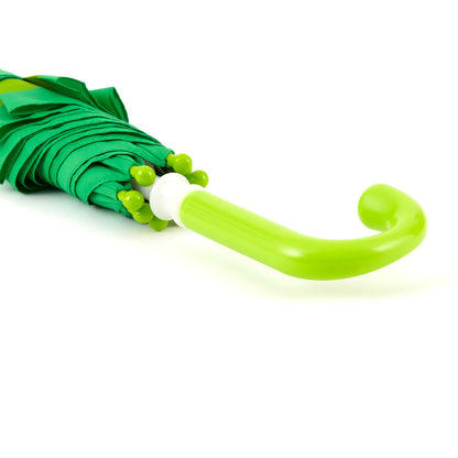 close up image of the handle of a brightly colored childrens umbrella in a kelly green frog design with a big red smile, lime green trim and pop-up eyeballs on top. matching lime green curved crook handle.