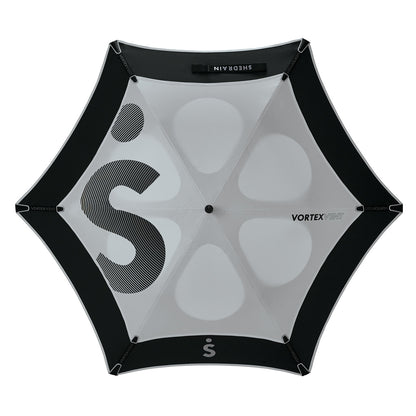 light grey and black vented double canopy wind-resistant three person golf umbrella with fiberglass frame and rubber grip, viewed from above with very large letter S logo