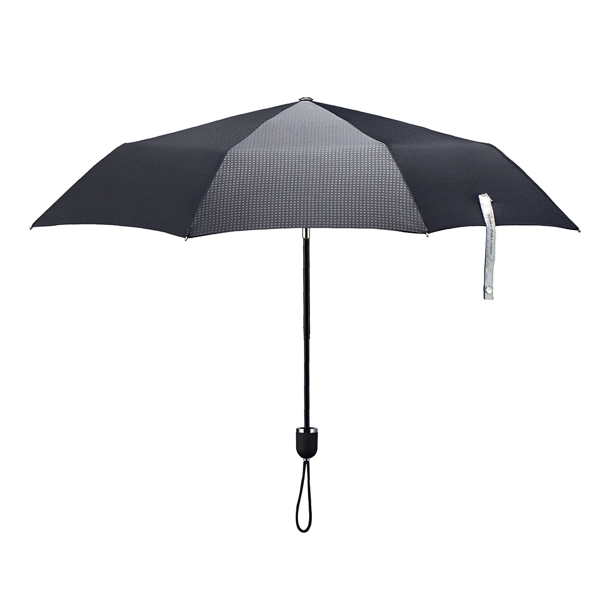 straight on view of a handmade manual open compact luxury umbrella with a matte black TPR grip handle, detachable waxed cotton wrist strap, Teflon-coated fine denier woven black polyester twill canopy, chrome trim, Trilobe aircraft aluminum shaft, fiberglass ribs, and a reflective strap embroidered with “ShedRain Stratus.”